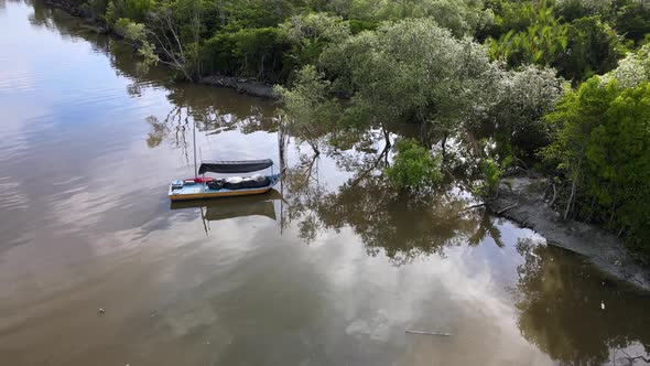 Aerial slowly move toward fishing boat