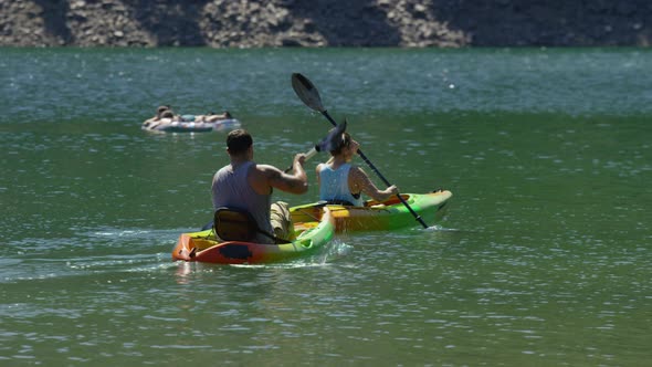 Couple kayaking in lake