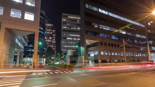 Night Cityscape in Business Area with Illuminated Skyscrapers Timelapse Hyperlapse