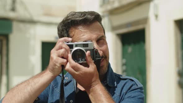 Front View of Handsome Caucasian Man with Camera