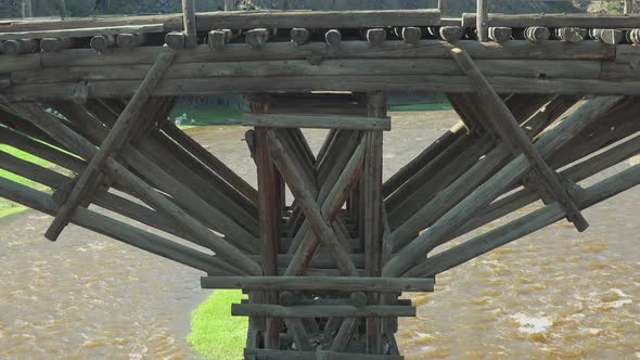 Timber Wooden Bridge Made of Tree Logs