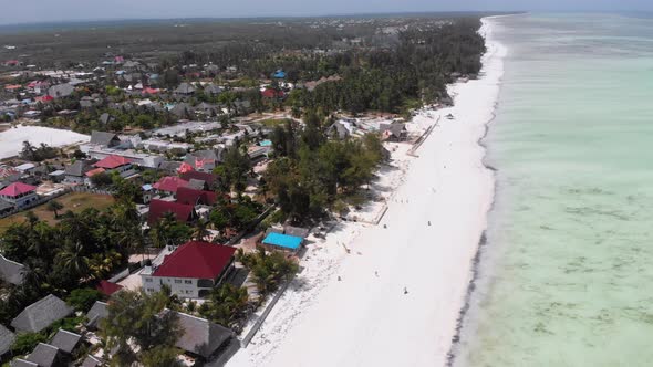 Ocean Coastline with Paradise Beach Hotels and Palm Trees Zanzibar Aerial View