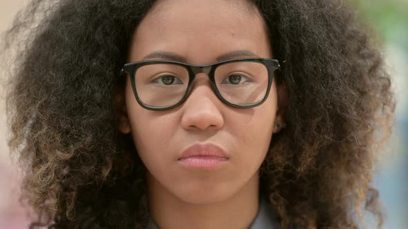 Close Up of Face of Young African Woman with Serious Expression
