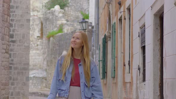 A Young Woman Visits the Old Town of Kotor in Montenegro