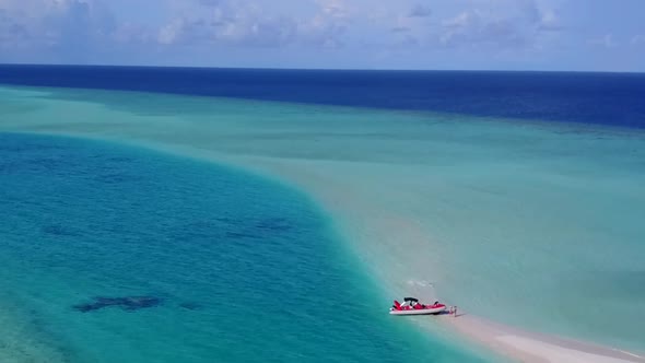 Aerial drone tourism of tropical resort beach voyage by blue water with sand background