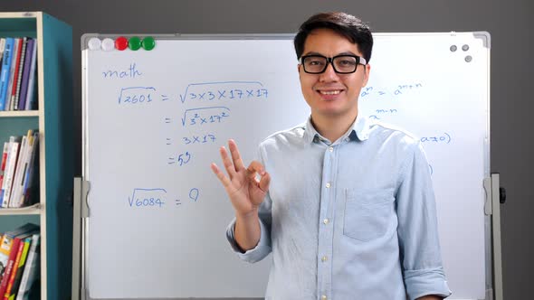 Male Asian Teacher Showing Ok Sign