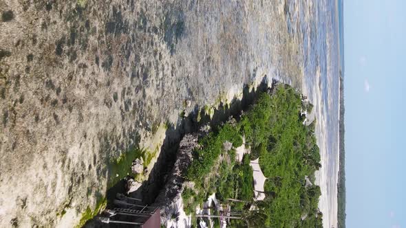 Vertical Video of Low Tide in the Ocean Near the Coast of Zanzibar Tanzania Aerial View