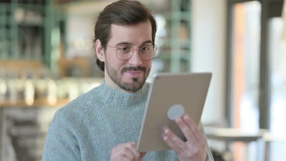 Portrait Successful Young Man Celebrating Tablet