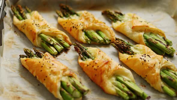 Baked Green Asparagus in Puff Pastry Sprinkled with Sesame Seeds