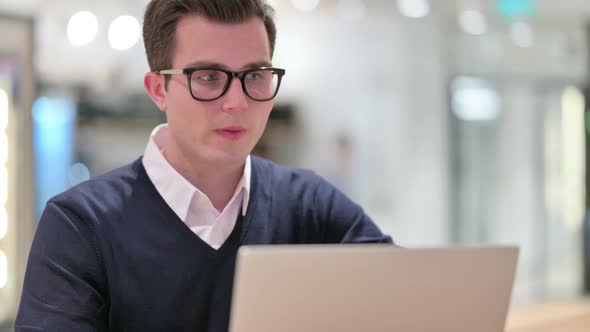 Young Businessman Doing Video Call on Laptop 