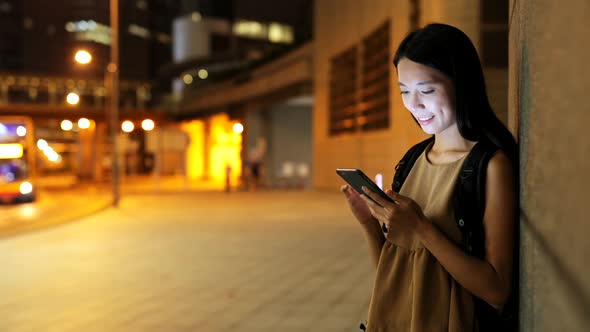 Woman Using Smart Phone at Night 