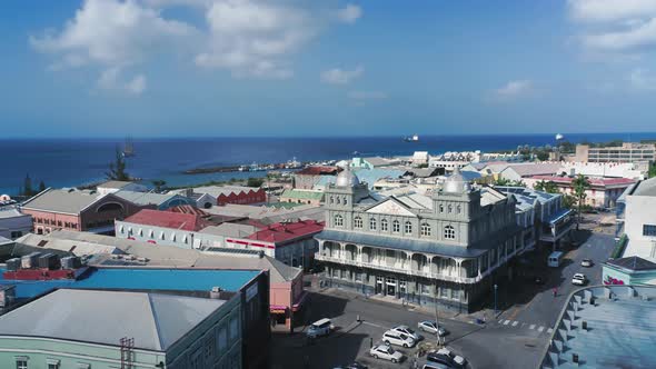 Aerial panorama over the city intersection with cars and yachts in Bridgetown, Barbados