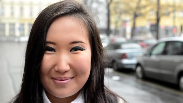 Young Attractive Asian Woman Smiles - Urban Street with Cars - City - Closeup