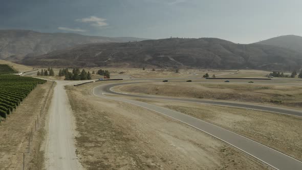 Aerial footage 4krs driving on a racing circuit, Osoyoos race track, Luxury Motorsports Club, Canada