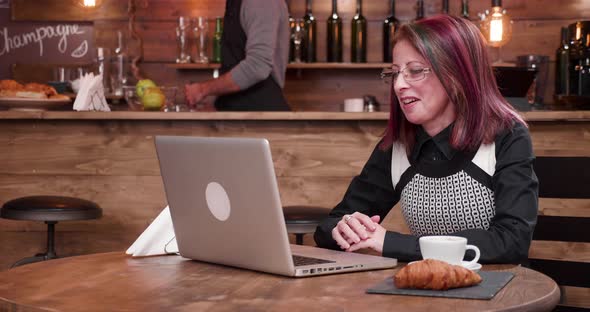 Adult Mature Businesswoman in Her 40s Having a Video Call Conference