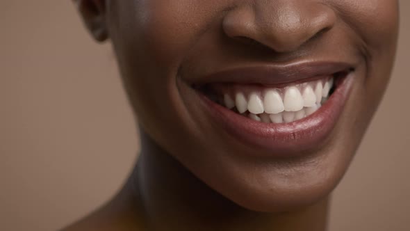 Cropped Shot Of African American Woman Smiling Over Beige Background