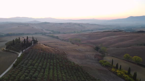 Val d'Orcia Valley with Farmhouse, Cypress Trees and Rolling Hills, Tuscany Aerial View