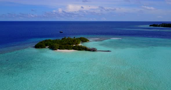 Wide angle birds eye abstract view of a white paradise beach and aqua blue water background