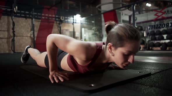 Sportswoman stretching in gym