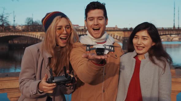 a Young Funloving Human Travel Blogger Launches a Quadrocopter Drone with His Hands Along with His