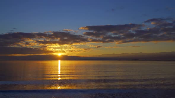 Beautiful View of Sunrise Over the Lake Early Morning