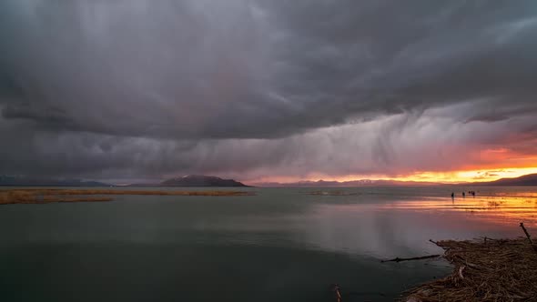 Time lapse of rain storm moving over Utah Lake with fishermen in the lake