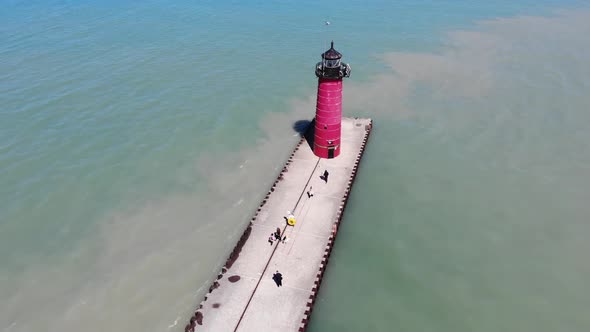 A Red Lighthouse Standing on the Shores of Lake Michigan. Lighthouse By the Lake in Kenosha