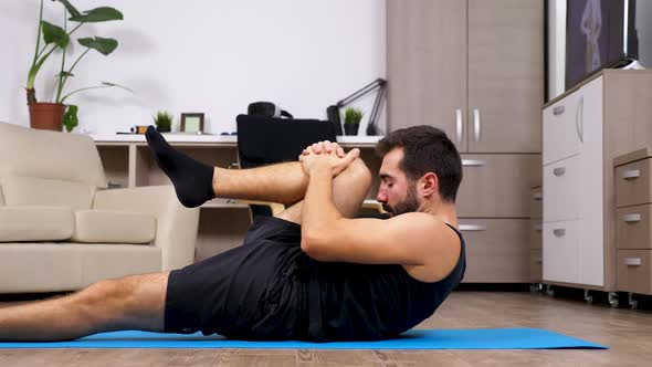 Fit Young Man Stretches for Yoga