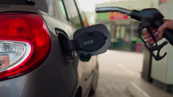 Refueling A Car With Fuel Filling Fuel Into A Car Tank Girl Driver Refuels Auto Gas Station For Cars