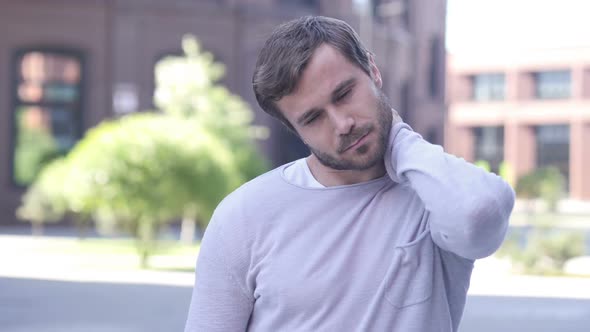 Tired Man Relaxing Neck Pain Outside Office