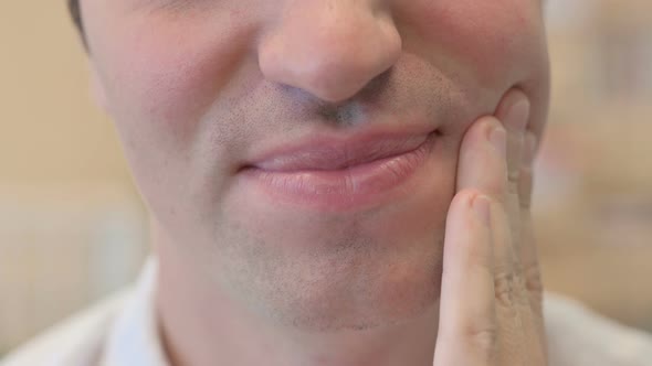 Close Up of Mouth of Young Man with Toothache