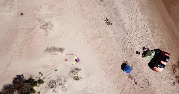 Top Down View of Solo Camping on Tropical Sandy Beach