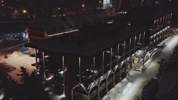 Zakopane hotel at night in winter. Aerial reverse