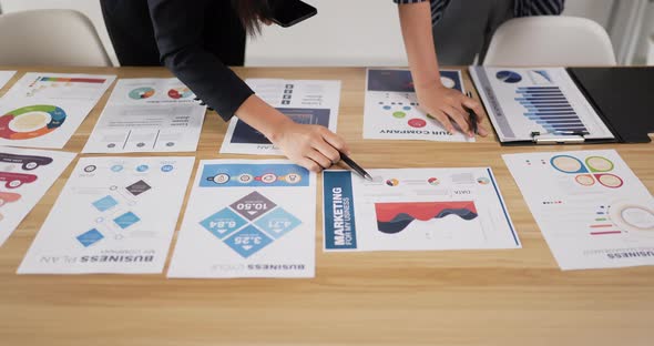 Closeup of hand woman manager employee pointing at business document