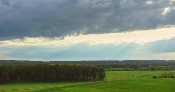 Fresh green spring view with green meadows and forests