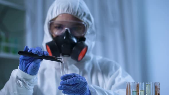 Laboratory Assistant Pouring Petrochemical Into Test Tube, Petroleum Industry