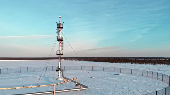 A Drone Flies Around a Pipe to Relieve Emergency Gas Pressure on the Pipeline of an Oil and Gas