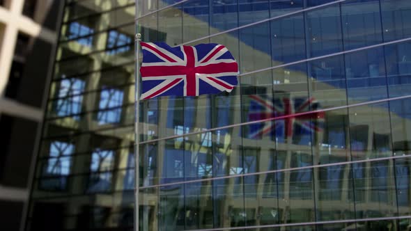 United Kingdom Flag Waving On A Skyscraper Building alt