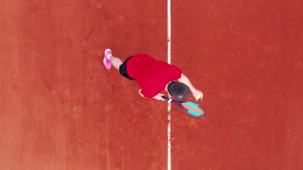 Top View of a Man Doing a Serve While Playing Tennis