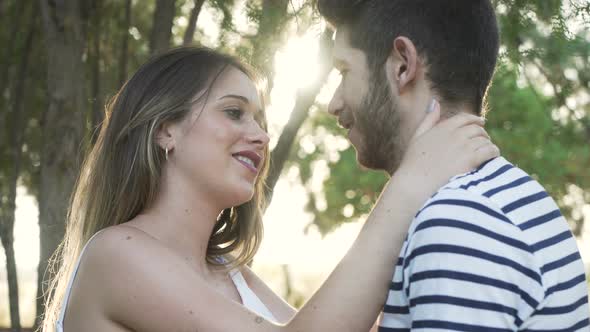 young couple kissing in a park