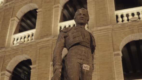 Statue of Toreador Manolo Montoliu on Plaza De Toros in Night Valencia