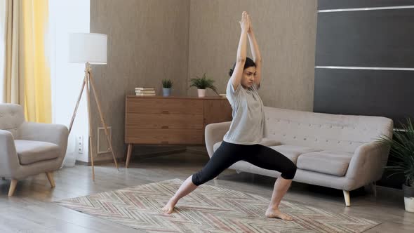 Young asian woman smile doing yoga exercises in home, exercising muscles for body health care