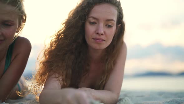 Curly Hair Model Pouring Sand From Hand