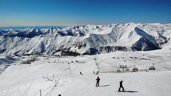 Tourists Enjoying Sports in Winter Ski Resort