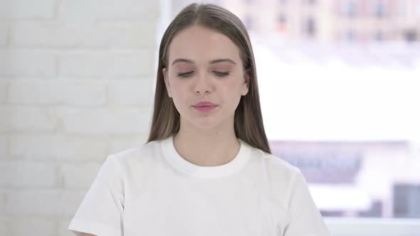 Portrait of Attractive Young Woman Crying Looking at the Camera 