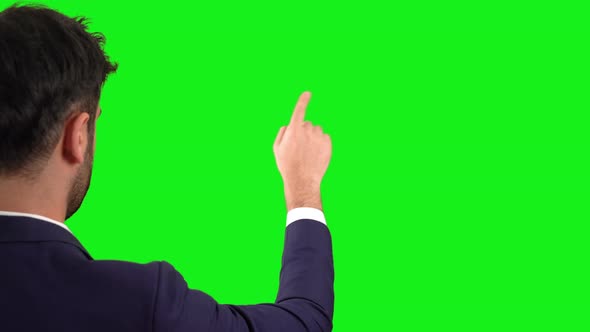 Touching the green screen. Green background.