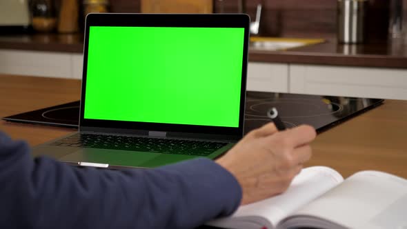 Close Up Green Screen Laptop Woman Student Study Writes Information to Notepad