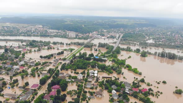 Environmental Disaster and Climate Change. Aerial View River That Flooded the City and Houses