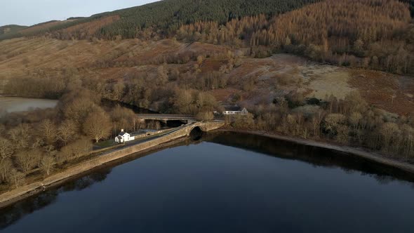 Old Bridge and Keeper's House on a Loch in Scotland