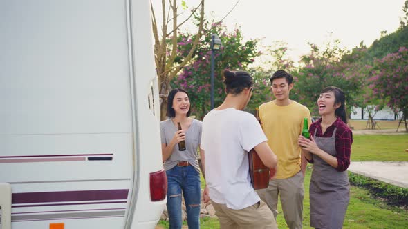 Group of Asian man and woman are having fun in new year party outdoor in the evening together.